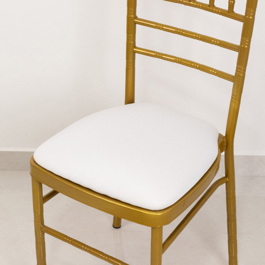 Gold bamboo chair with a white padded seat