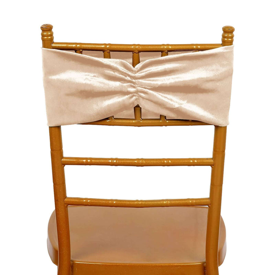 Gold chiavari chair with a cream satin bow on the back.