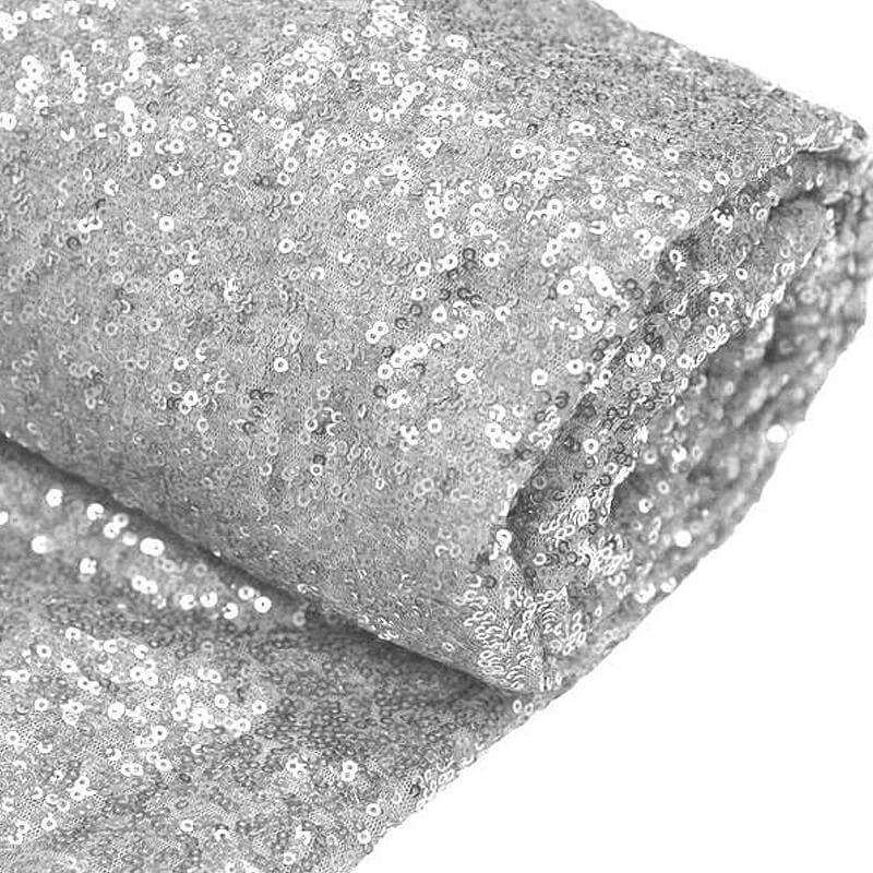 Silver sequin fabric rolled up, perfect for crafts and decorations. #whtbkgd