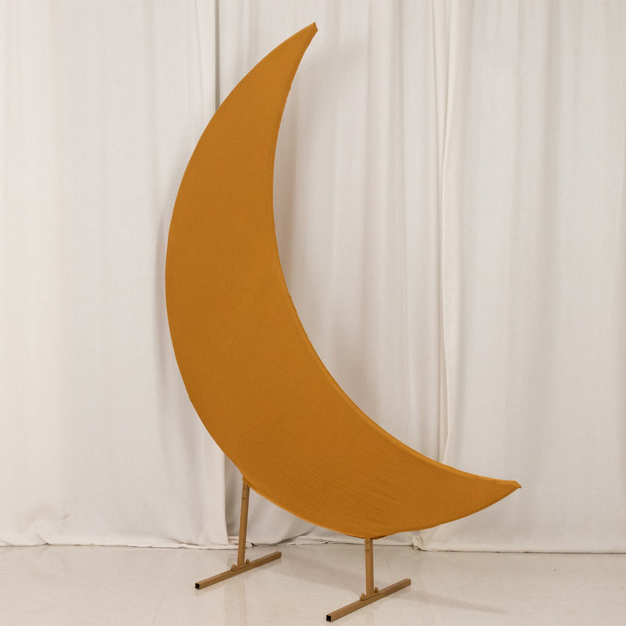 Orange crescent moon sculpture on a stand against a white backdrop