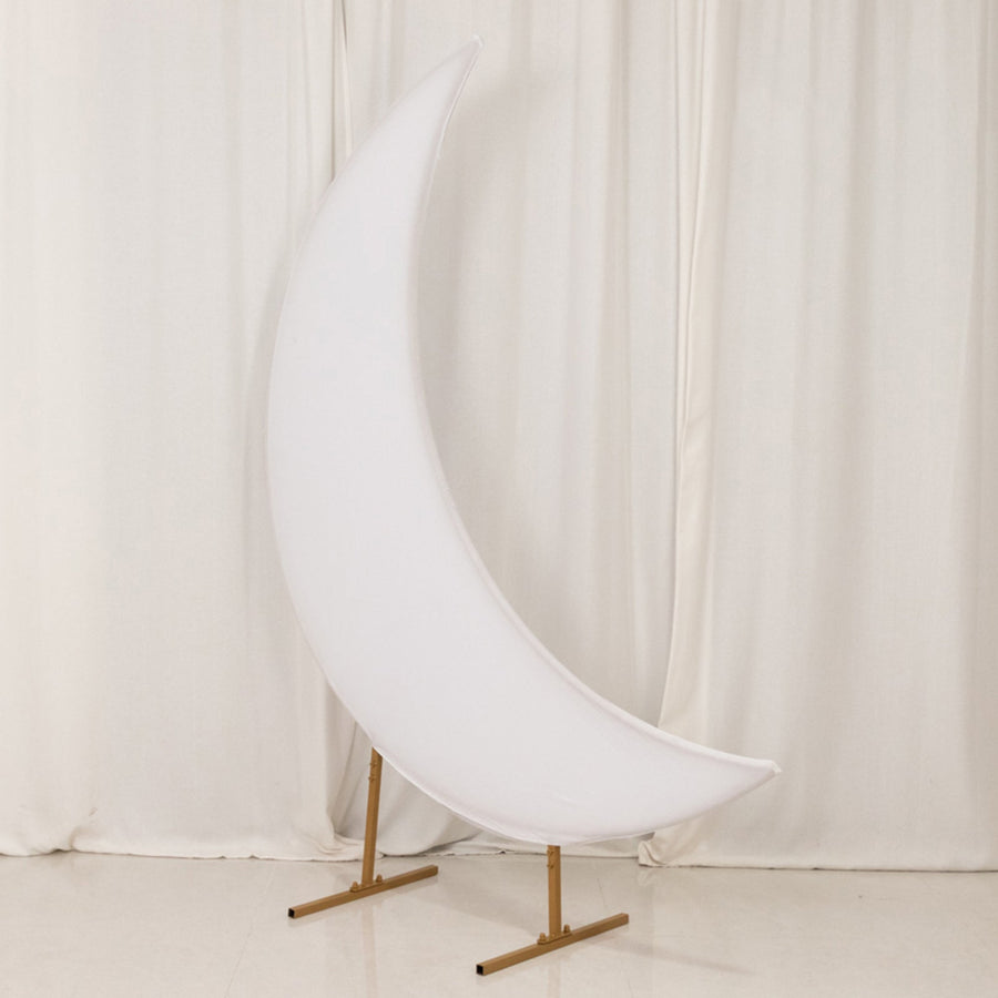 White crescent moon-shaped prop on a gold stand against a light backdrop.