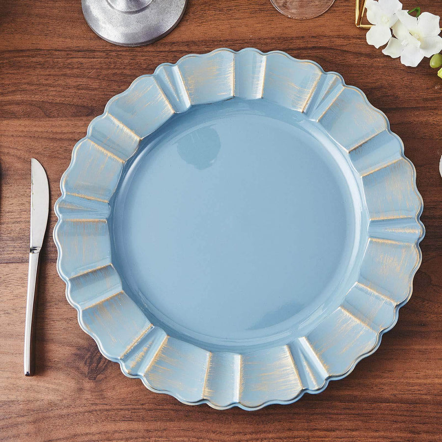 Blue scalloped plate with gold accents on a wooden table.