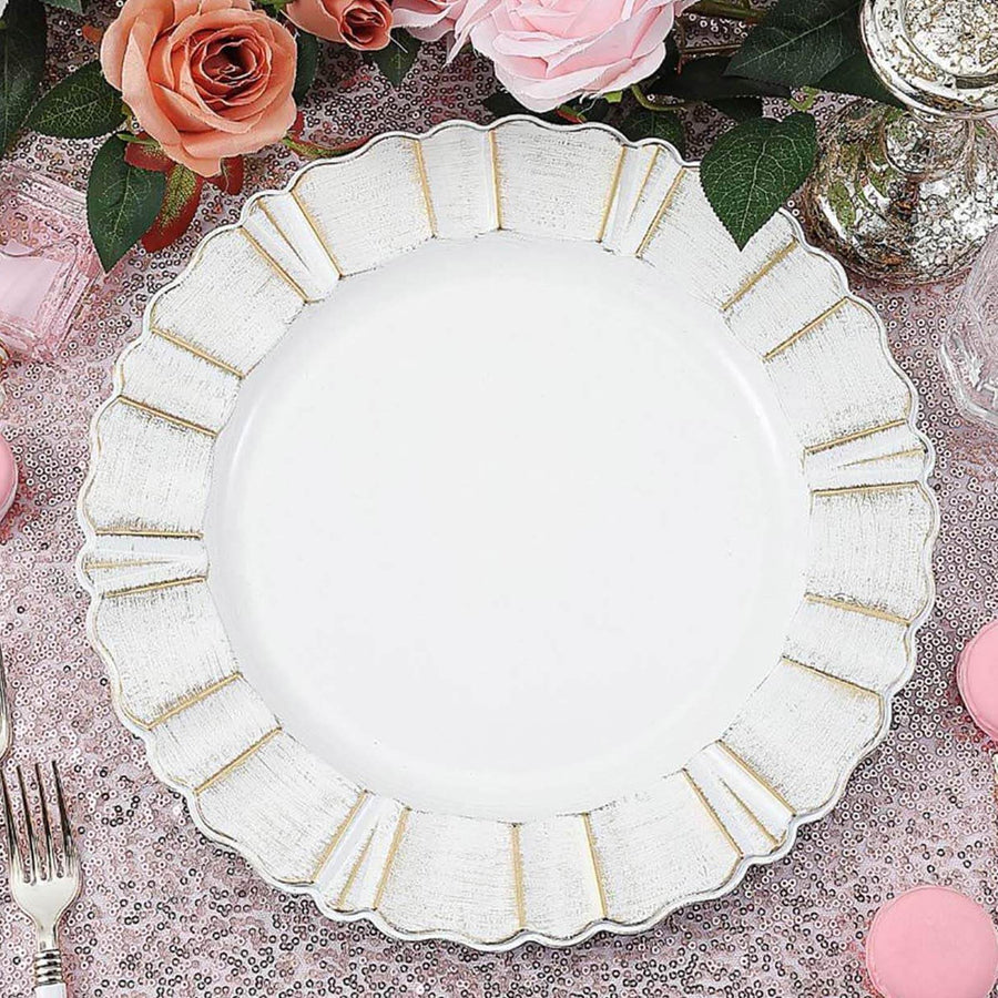 White plate with gold trim on a pink sequined table setting.