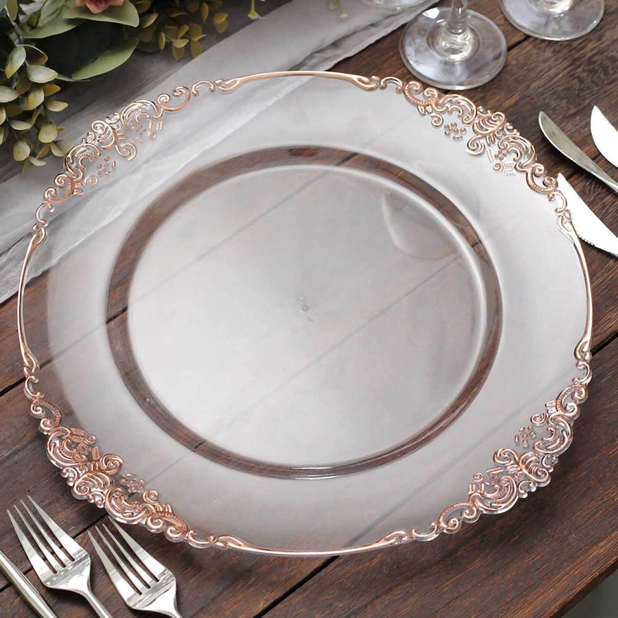 Elegant decorative clear plate with rose gold accents on a wooden table.