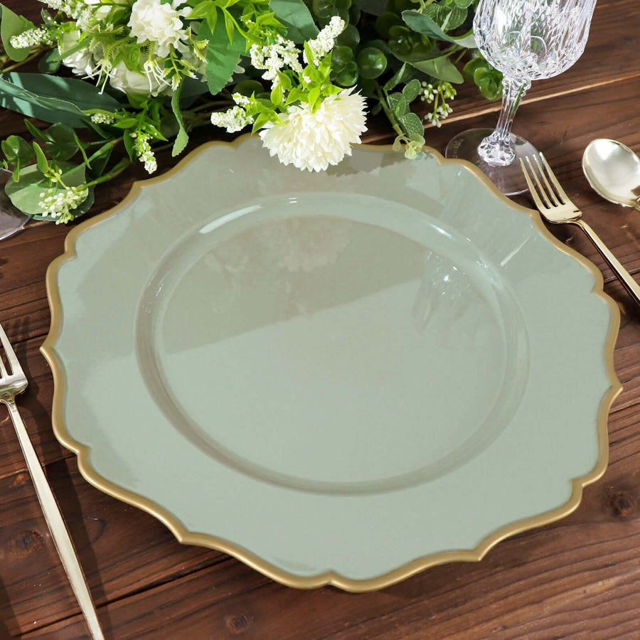 Elegant scalloped green plate with gold rim on wooden table setting.
