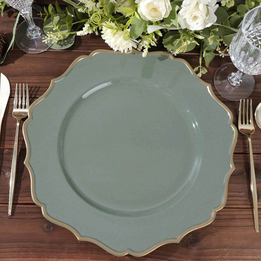 Elegant green scalloped plate set on a rustic wooden table with silverware and floral decor.