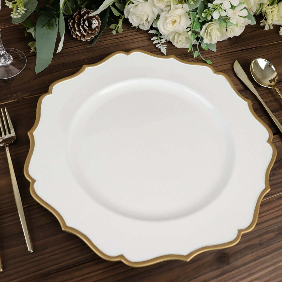 Elegant white plate with gold scalloped edge on a wooden table setting.