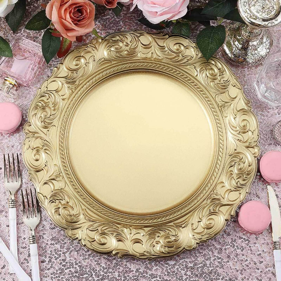 Elegant gold ornate charger plate on a pink sequin tablecloth with floral accents.