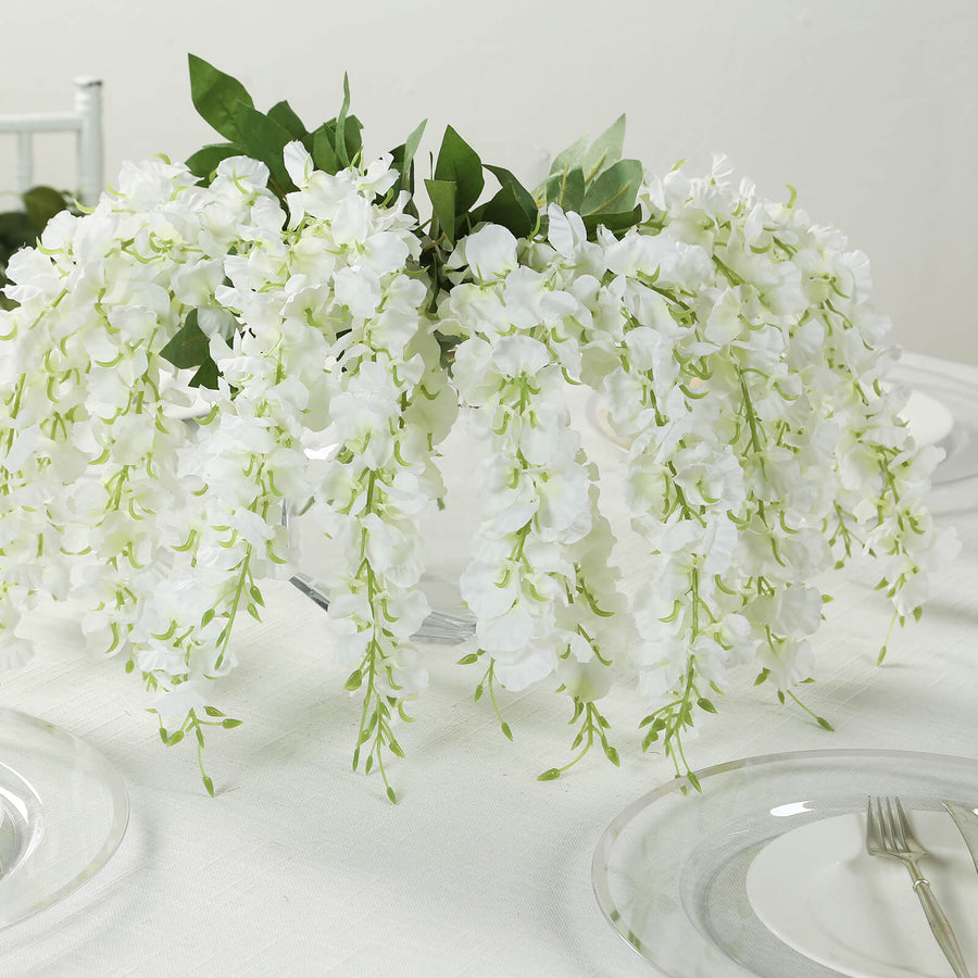 White wisteria floral centerpiece for elegant table decor.