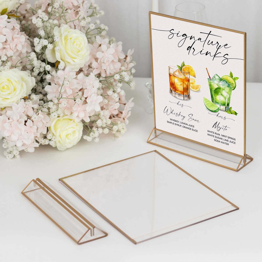 Elegant drink menu display with gold accents next to floral arrangement.
