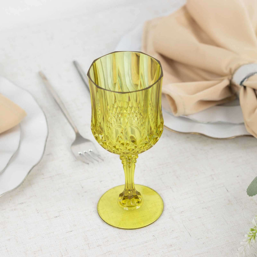 Yellow decorative glass on a table setting with napkin and plates.