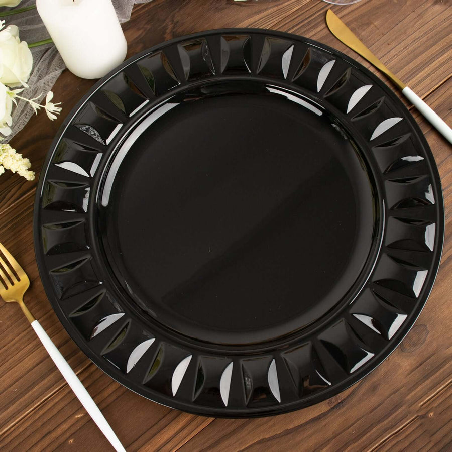 Black decorative plate on a wooden table setting.