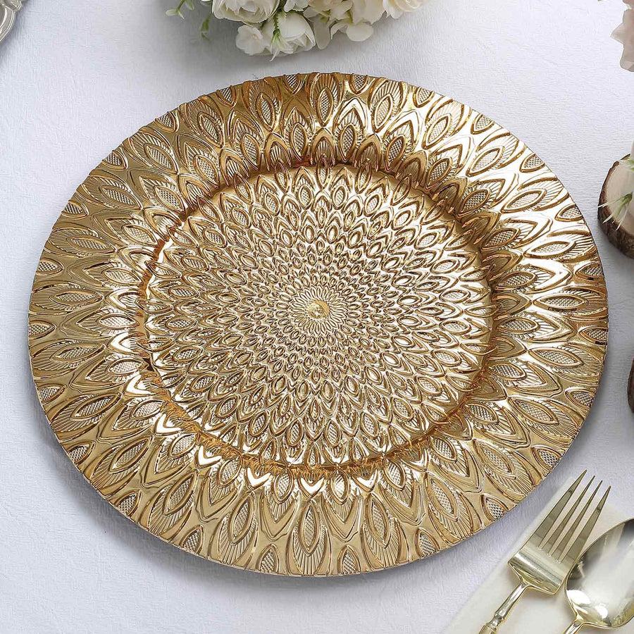 Gold decorative plate with intricate floral design on a white background.