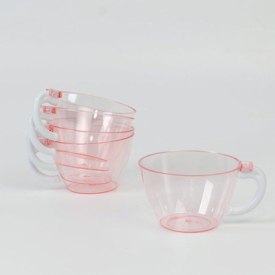 Set of four transparent pink measuring cups stacked together.