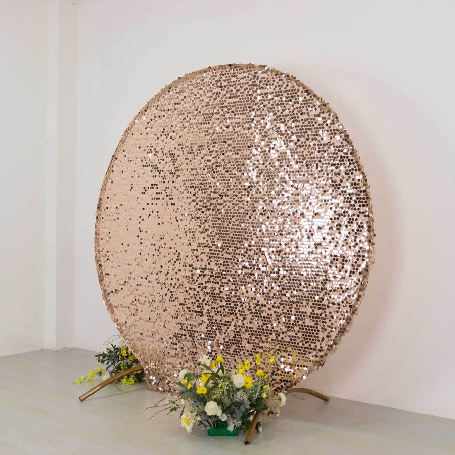 Rose gold sequin backdrop with floral accents for events and photography.