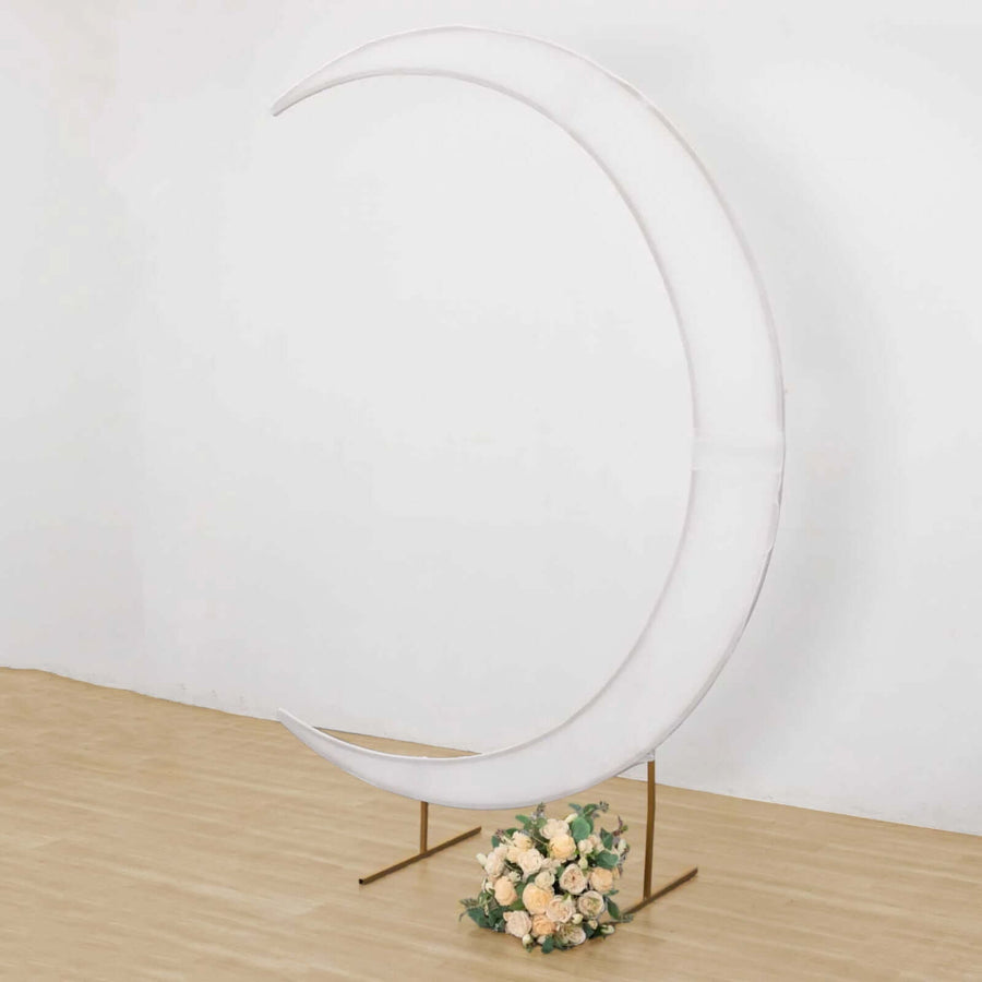 White crescent moon backdrop with floral arrangement for events or photography