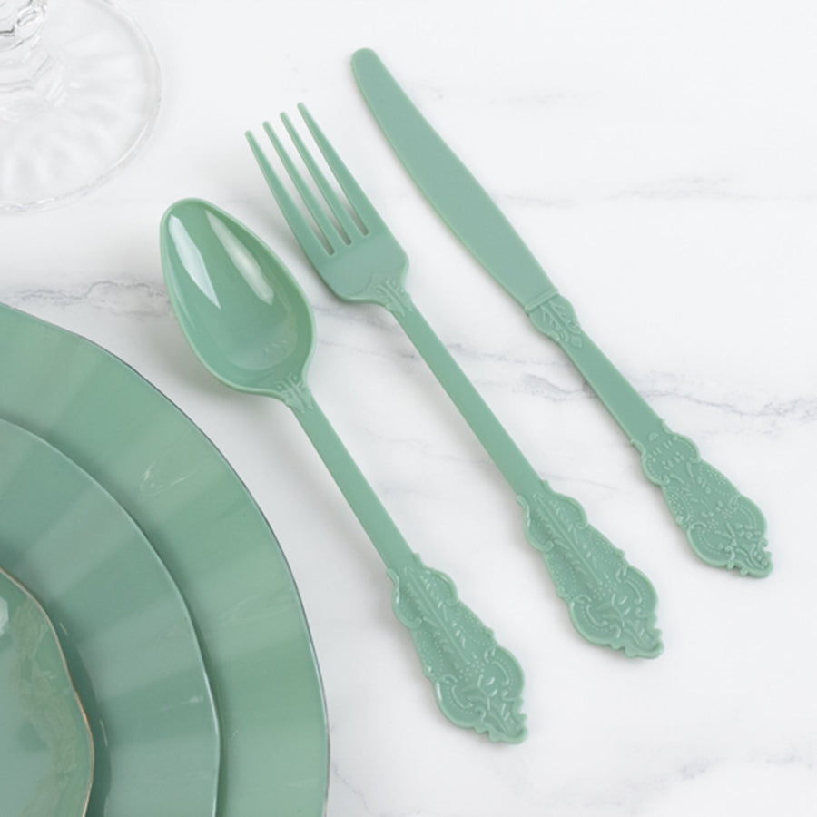 Mint green plastic cutlery set on a marble surface.