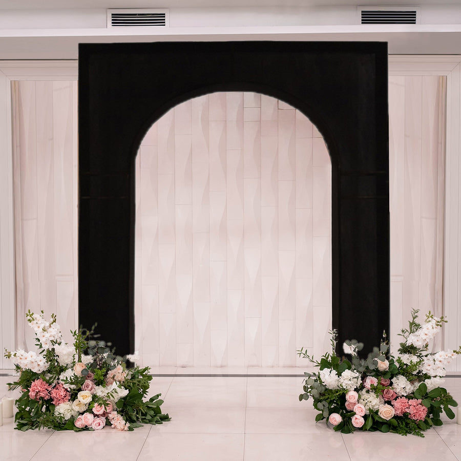 Elegant black arch with floral arrangements, perfect for weddings or events.