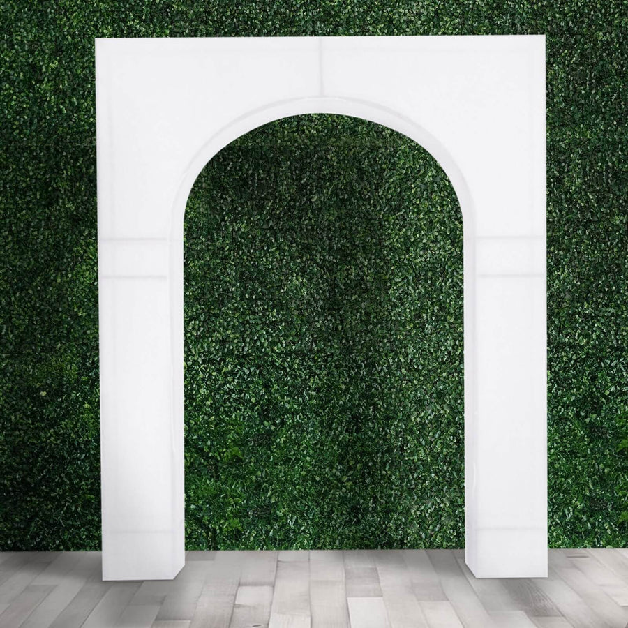 White decorative arch against a green foliage backdrop.