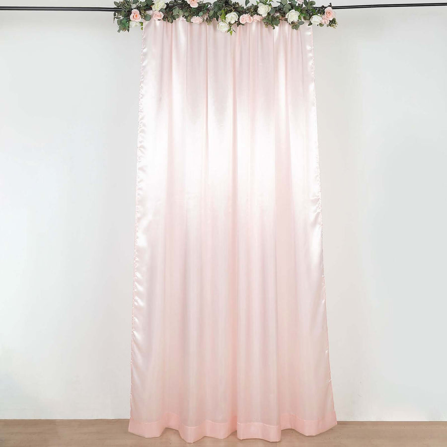 Blush pink satin curtain with floral top, elegant home decor option.