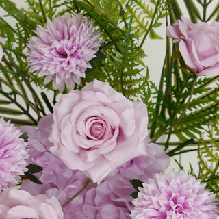 Pink artificial flowers arrangement with green leaves