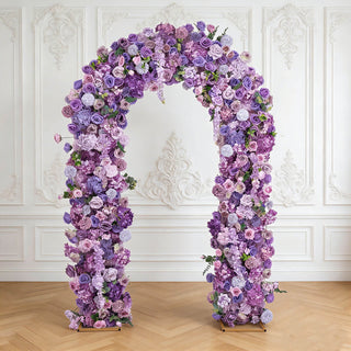 Lavender floral arch with purple roses in elegant white interior