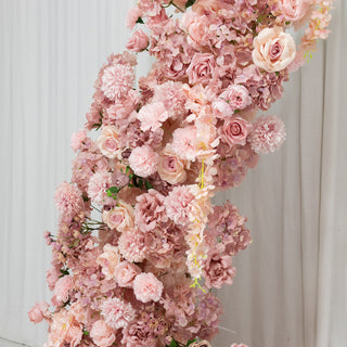 Artificial pink floral arrangement with roses and hydrangeas.