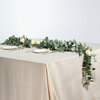 Add a Touch of Elegance with the Green/Ivory Artificial Eucalyptus Leaf and Rose Flower Garland Vine Add a Touch of Elegance with the Green/Ivory Artificial Eucalyptus Leaf and Rose Flower Garland Vine