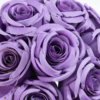 Purple fabric roses arranged in a bouquet.