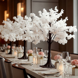 Elegant white flower tree centerpiece for dining table decor.