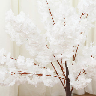Artificial white cherry blossom tree with detailed branches and flowers