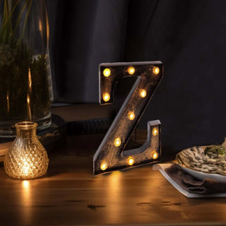 Light-up decorative letter "Z" on a wooden surface with warm ambiance.