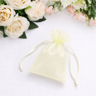 Sheer ivory organza gift pouch with floral background on white fabric