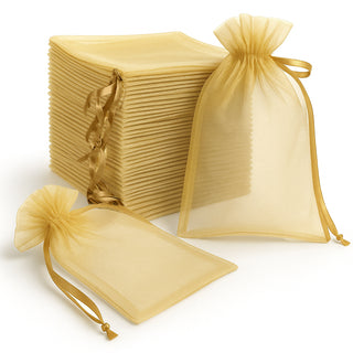 Gold organza bags set with ribbons for gift wrapping and storage
