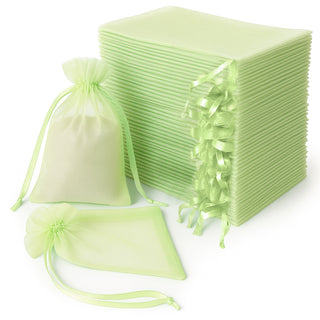 Set of green organza bags and sheets for gifts and crafts