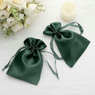 Green satin drawstring bags for elegant gift packaging.