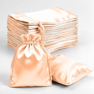 Set of luxurious satin drawstring bags in peach color