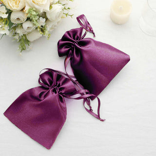 Purple satin drawstring bags for gifts or favors.