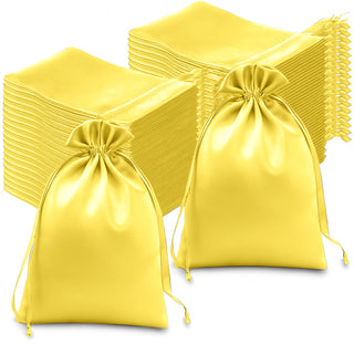 Yellow satin drawstring bags, perfect for gifts or party favors.