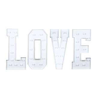 White marquee letters spelling LOVE with built-in lights on a white background#whtbkgd