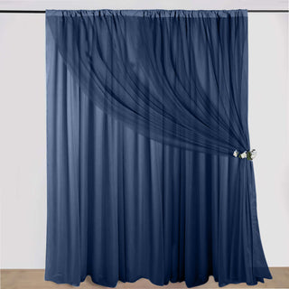 Navy sheer curtain draped elegantly with a decorative tieback.
