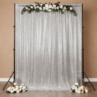 Sequin backdrop with floral arrangement for events and photography.
