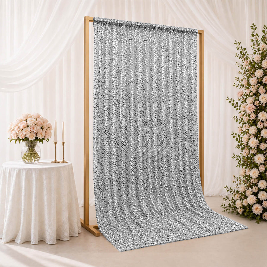 Silver sequin wedding backdrop curtain on gold frame with floral decor