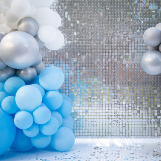 Blue and silver balloon decoration with a mirrored backdrop.