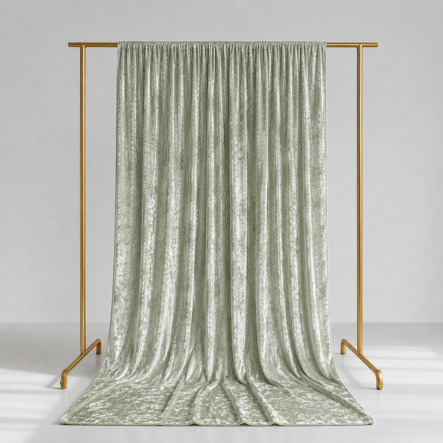 Sage green velvet curtains on gold clothing rack, elegant studio backdrop