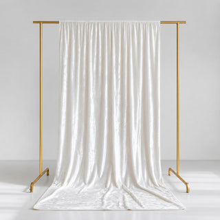 Elegant white satin curtain on gold garment rack, minimalist studio backdrop