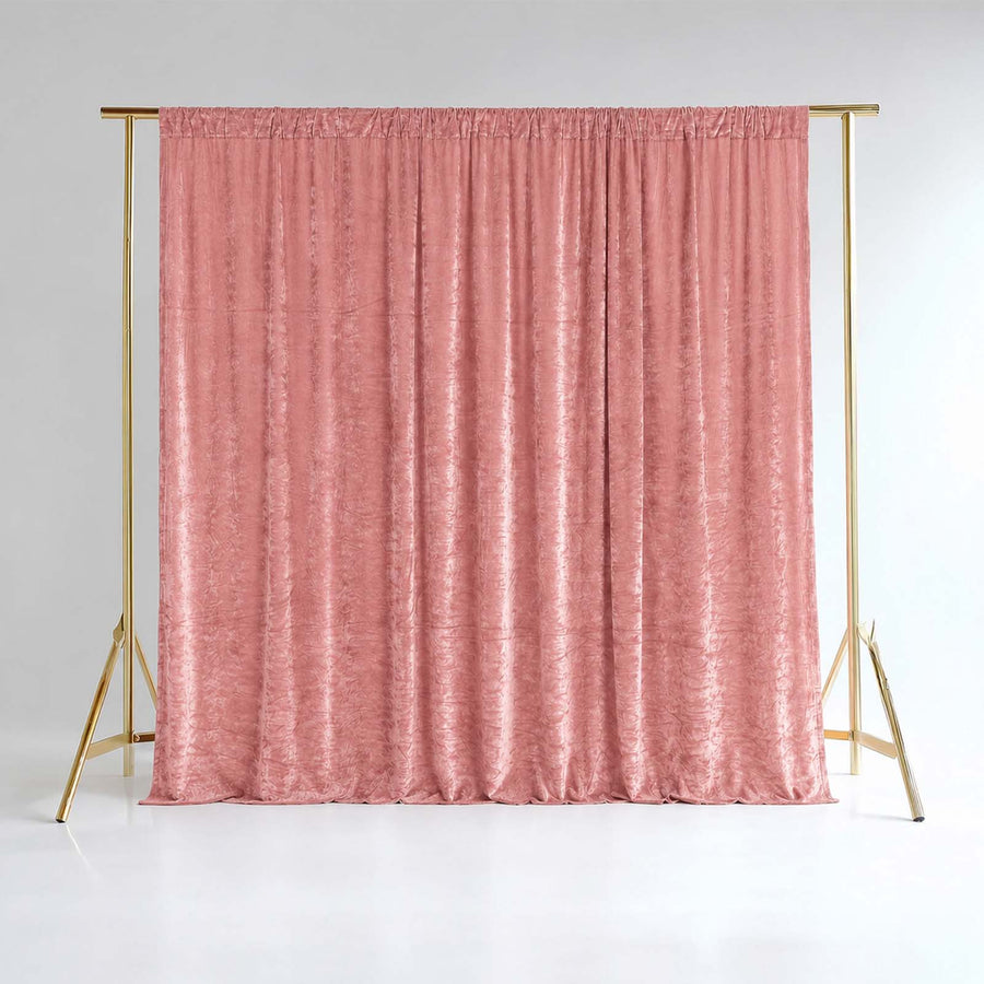 Pink velvet curtain on gold backdrop stand in a studio setting