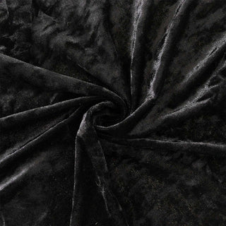 Black velvet fabric texture with soft folds and swirls#whtbkgd