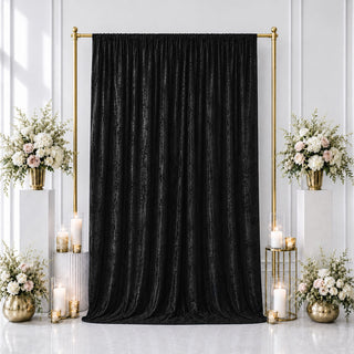 Elegant black wedding backdrop with gold frame and floral arrangements