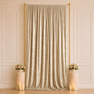 Elegant champagne curtain backdrop with gold frame and floral candle decor